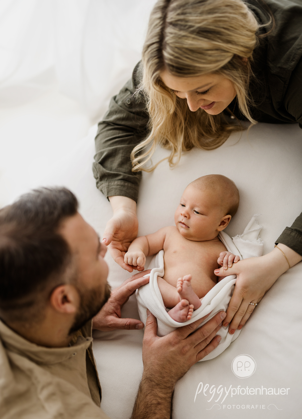 Mama und Papa mit Baby